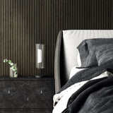 Hilo Table Light by Kuzco - Black, On table in bedroom